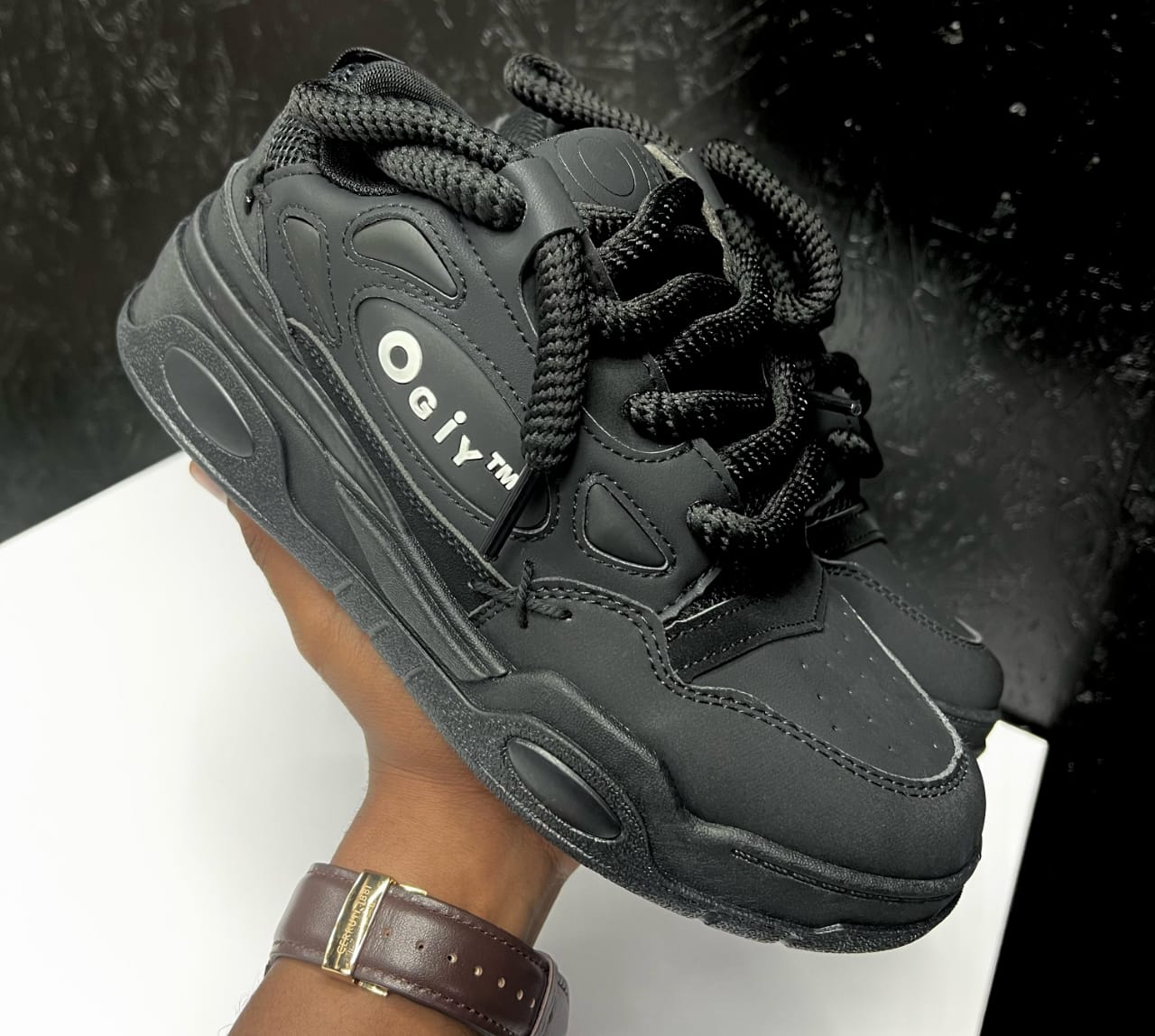 Stylish sneakers with chunky soles and unique lacing.