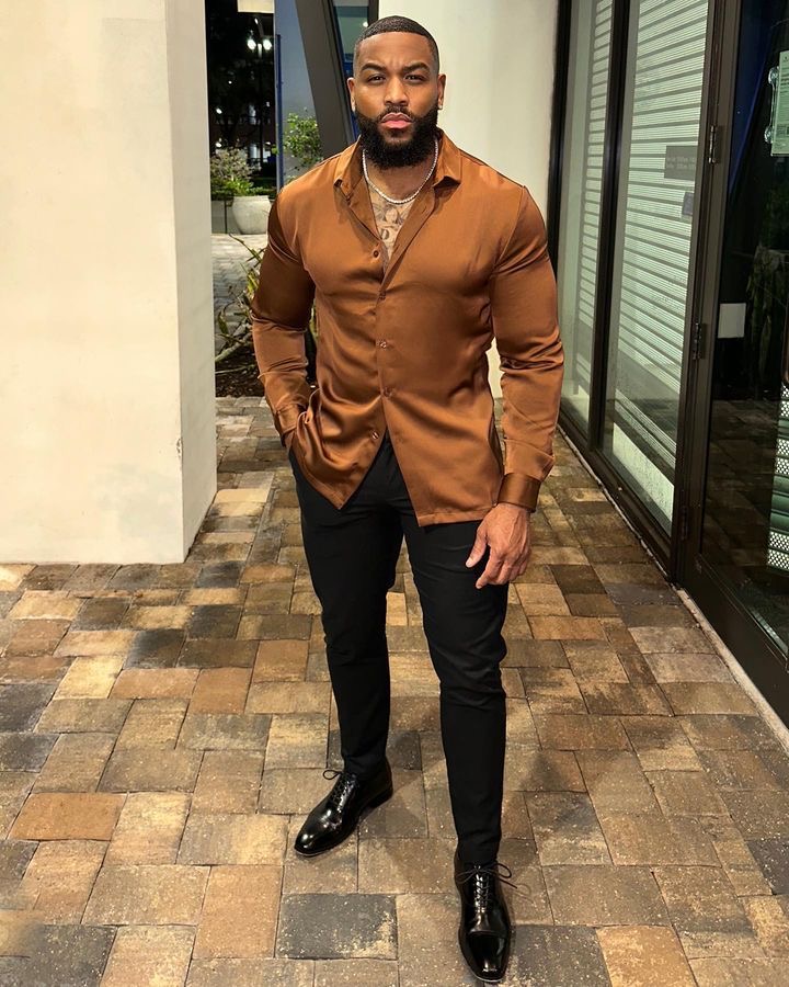 A man in a stylish shirt and pants.
